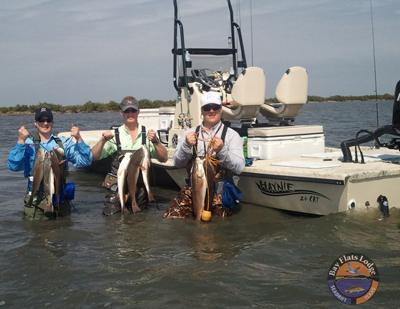 Capt. Cooper with Bay Flats Lodge wade fishing with TTF lures; San Antonio Bay; Preston Kamin party; Feb. 19, 2011.