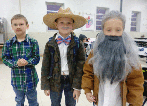Port O’Connor First Graders, Jaydin Rhoads, Luke Doggett, and Cole Spicak dressed as “110-year-olds” for the 100th day of school.