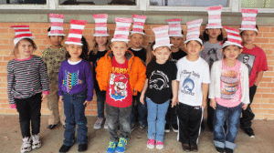 Kindergarten students show off the hats they made to celebrate Dr. Seuss' birthday.