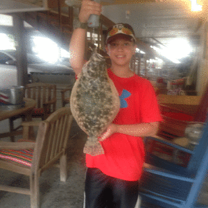 Jaxson Chambers, grandson of Cal and Irene Junek caught this flounder fishing off the dock at Alligator Head. 