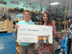  Port O’Connor Rod &  Gun – Port O’Connor Rod & Gun will be a Catch of the Day Sponsor for this year’s 25th Annual Pescado Grande Fishing Tournament slated for June 26-27, 2015 at the Port O’Connor Community Center Pavilion in Port O’Connor.  Donnie Klesel of Port O’Connor Rod & Gun is photographed above presenting a check in the amount of $500 to The Harbor Executive Director, Maria T. Flores. 