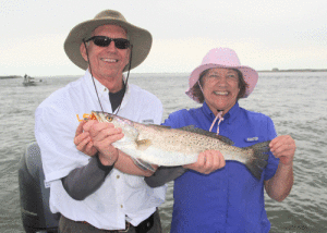 Houston anglers Keith and Janice couldn’t be happier with this solid jetty trout, a limit of slot reds, along with numbers of sheepshead and black drum. Most were caught on a hard running tide with live shrimp fished on bottom.  Capt. Robert Sloan photo
