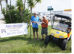 Bill Tigrett of Port O’Connor Chamber of Commerce happily accepts a Fireworks Donation from Paul McGee of POC Cruisers.