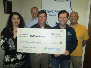 Seadrift Coke Employees: Eric Skach, President/General Manager; Bret Martinets, Human Resources Manager; Erik Wheelock, Vice President of Sales & Marketing; and Adonai Hernandez, Financial Director present a check in the amount of $1000 to The Harbor Executive Director, Maria T. Flores.  Seadrift Coke is a Biggest Catch Sponsor of the 25th Annual Pescado Grande Fishing Tournament which is planned for June 26-27, 2015 at the Port O’Connor Community Center Pavilion. 
