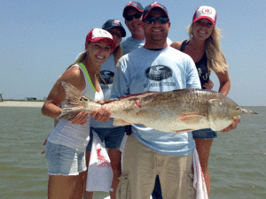 Warrior Zach Billingsley with his winning fish. Second and third from left: Veterans Jenna Hughes and Chris Paxton. At left: Jenny Nagelmueller; right: Haley Ray.
