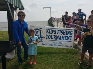  Donnie Klesel of POC Chamber of Commerce with one of the winners of the Memorial Day Kids Fishing Tournament.