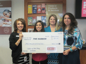 Rachel Morgenroth, Marissa Villarreal, and Cyndi Alvarez of TDECU present a $500 check for the Pescado Grande