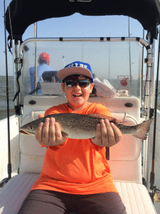 Logan Dazer from Hurst, Texas with one of the Speckled Trout that he caught on July 9th while fishing with Capt. RJ Shelly.