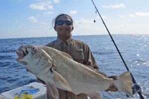 Kurtis Carville from Grand Junction, Colorado, with the large Black Drum he caught while fishing in Port O’Connor.