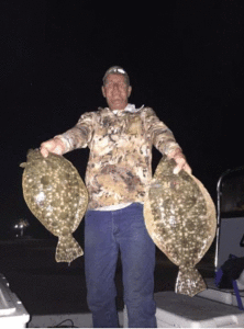 Scott with 2 big’unz at dark 30. -Capt. Jeff Larson