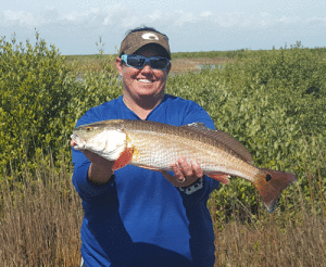 Mowdy Boats Lady Pro, Amy Crapitto Weitinger with a Backwater Red. -Capt. Jeff Larson