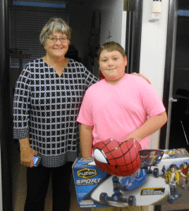 Ethan Redding was the lucky winner of a scooter and helmet in the Bringing Up Grades drawing. Jane Daniel from the Kiwanis Club presented Ethan with his prize at Port O’Connor School.