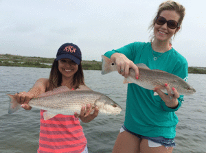Nicole (left) and Katy (right) from San Antonio with a pair of redfish that they caught while fishing with Capt. RJ Shelly on April 30, 2016. 