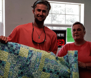POC Chamber of Commerce Raffle  	Kent Waters of El Campo is the proud winner of the handmade quilt that was raffled off to help with the fireworks show expenses. The quilt was made by the ladies that stay at Beacon 44 RV Park in the Winter. Pictured is Kent Waters with Chamber President Mary Jo Walker. 