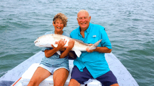 Ray and Claudia Nunley (aka Mei Mei) with Ray’s 1st Bull Red. A Bucket List check off!! -Capt. Jeff Larson