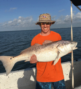 Ty Reisinger from Williamsport, Ohio with a 41 inch redfish that he caught near Bird Island on July 16th. The fish was released to fight another day. -Capt. RJ Shelly