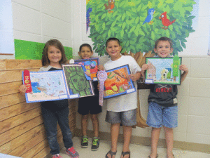 2nd Grade Gracie O’Shields (1st place oil pastels and 2nd place crayon), Leland Carriles (3rd place marker), Landon Jones (Reserve Champion color resist), Connor Ferrell (Honorable Mention crayon) 