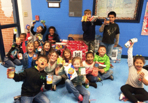 Port O’Connor Elementary students collected over 600 cans of food for the the local food pantry. First grade students are shown here with several of the cans which were collected.