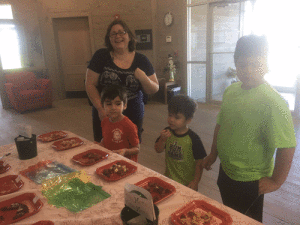Roxanne Ochoa & sons taste-testing cookies at FNB