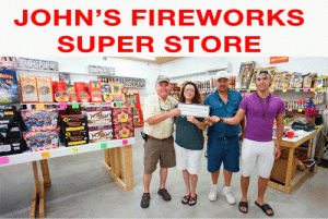 Bill Tigrett, accepts a Fireworks Sky Rocket Sponsorship donation from JOHN’S FIREWORKS SUPER STORE for the 4th of July Fireworks show. John’s Fireworks Super Store is the only indoor fireworks store in POC.