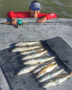 Ms. Glover had a productive day fishing with Capt. Jeff Larson. Wading is the key throughout the summer to box a limit of trout.