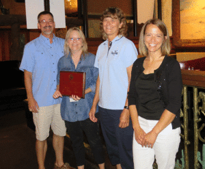 Rhonda Cummins, Texas Sea Grant’s Coastal and Marine Resources Agent for Calhoun County, was recognized Tuesday, June 25, by the Texas Extension Specialists Association (TESA) with an award for Distinguished Program Achievement in Community and Resource Development. Pictured are, from left, TESA President Steven Klose, TESA Past President DeDe Jones, Cummins and Rebekka Dudensing, associate professor of agricultural economics and extension economist at Texas A&M University, who nominated Cummins for the award. (Photo courtesy Texas Sea Grant)