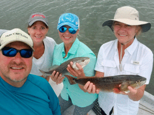 Fishing with Capt. Jeff Larson - (L to R): Capt. Larson and wife Dawn, Kristin Vance and Janette Yanchak