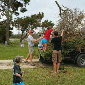 POC kids of all ages came together to clean up the fallen tree limbs, bush and debris caused by Hurricane Harvey at the Port O’Connor Cemetery. -Photo by Sarah Washburn