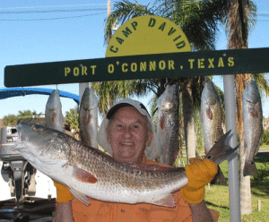Heinz Reichardt holding his hefty redfish. In his eighties, Heinz still loves to fish and visit Port O’Connor. 