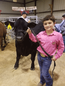 Justice Epley with his Grand Champion Market Steer 