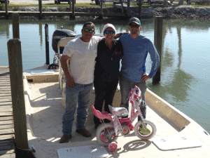 Annette, Mark and Kole with the little pink bike 