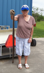 Chantal Hawes holds a 43” rattlesnake her husband Freddie killed on their POC property on April 4th.