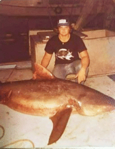 Mike at age 19, with shark he caught off Henry Apostolo’s shrimp boat.