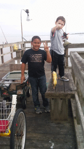 Fishing at the Port O’Connor Pier, Justin, age 9, caught his first bonnethead shark and Kyle, age 7, caught a puffer fish.