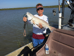 Robin the Barber on her day off with Captain Ed Campbell. Slinging live mullet, or as Ed likes to say, “Ed Wigglers”. Capt. Jeff Larson 