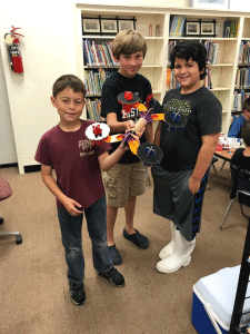 Three Port O’Connor Elementary students show their creations from the STEM Fun with Legos event on April 21, 2018, sponsored by the Friends of the POC Library. Photo by M. Marlin