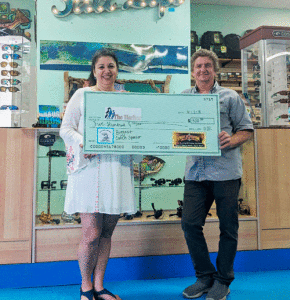 Maria Walton, Executive Director of The Harbor, accepts a generous donation from Donnie Klesel of Port O’Connor Rod and Gun. The Harbor’s annual fund raising tournament (Pescado Grande) will be held June 30 in Port O’Connor.