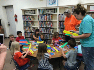 “Children of all ages enjoyed the Build-A-Boat STEM event held on May 12, 2018 at the POC Library. Thank you to Friends of the POC Library for holding the event and especially to Joanie Morgan, Mary Ann Claiborne and Alane Haardt who helped the children learn about STEM principles during the boat building and racing.” -Photo by M. Marlin