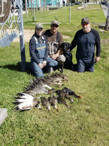 Friends and Family Opener: Prois Pro Mitzi Wiess putting her hubby and friend, Glen, on some migrators. -Capt. Jeff Larson