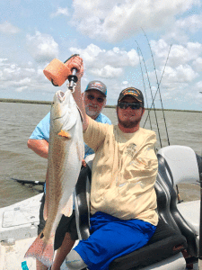 Robert with wounded warrior and his big catch.