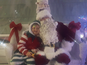 Cash Shirall visits with Santa Claus. 