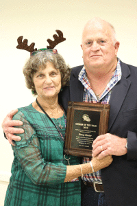 Marie Hawes presents plaque to Kenny Finster.