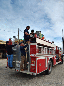 While Santa visited with kids inside the Fire Station, Port O’Connor Volunteer Firemen gave children a ride on the fire truck. -Photos by Patricia Mayhall