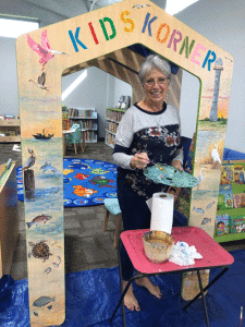 LeeAnn Kunz adorning the POC Library reading house. 
