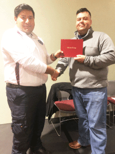 Erwin Silva, left, of Port Lavaca poses with Victoria College Emergency Medical Services Program Clinical Coordinator Emilio Reyes during the Dec. 11 graduation ceremony honoring VC’s Fall 2018 Emergency Medical Technician students at VC’s Student Center.