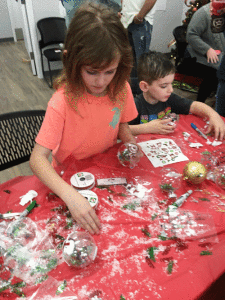 Clara and Jacob Stryker create ornaments at the POC Friends of the Library Children’s Christmas party on December 22, 2018. Photo by Mary Ann Claiborne 