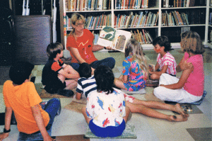 June 1988 Mary Ann Claiborne reads Jack & the Bean Stalk at the volunteer-run Port O’Connor Library (current location of the Volunteer Fire Station)