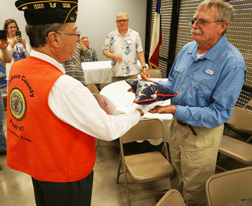 Honor Guard Commander Ralph Belter presents flag to Chuck Carter						         Photo by Phil Thomae 