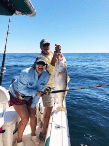 Callie Dick showing off her first bull red caught 10 miles offshore. The 40.0” red was returned to the water after the picture was taken.  Fishing with Captain Frank Faubion on the “Happy Hooker”.  