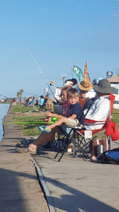 Zane and Zoey Henning fishing in the Shrimpfest Kids fishing Tournament